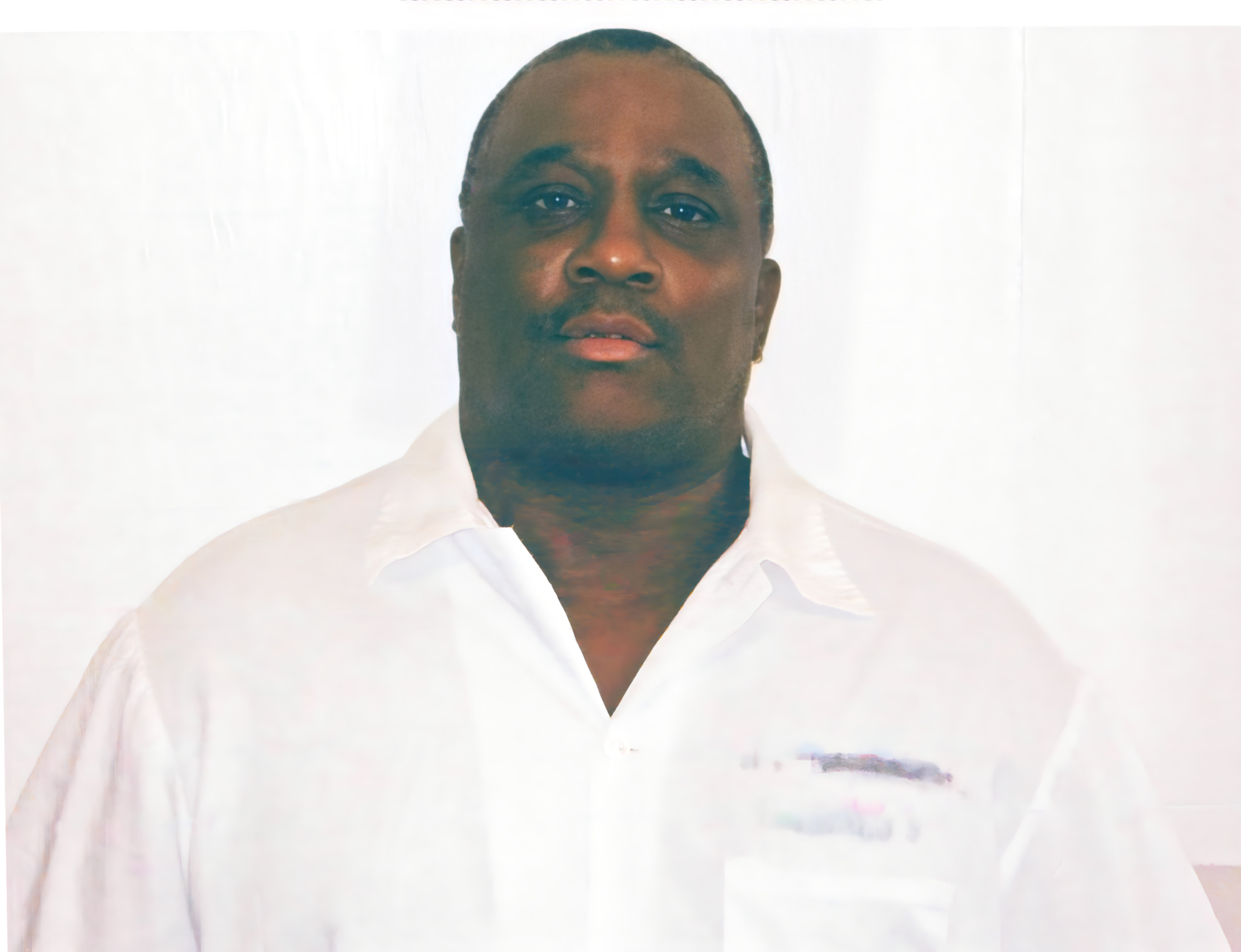Rocky Myers wearing a white button up shirt