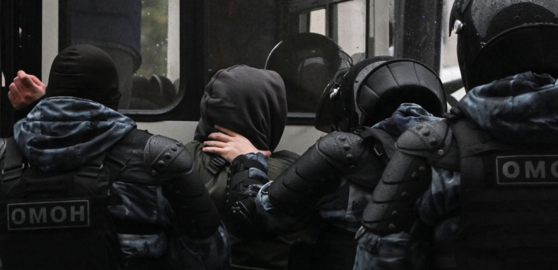 Police officers detain a man in Moscow on September 24, 2022, following calls to protest against the partial mobilisation announced by the Russian President. Photo by AFP via Getty Images.