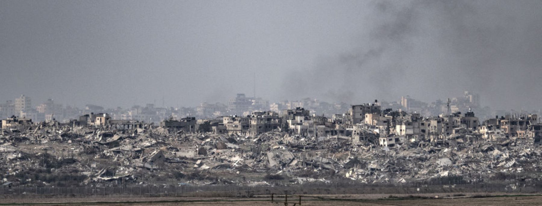 Smoke rising from the buildings in Gaza after Israeli attacks is seen from Israel on January 17, 2024. Photo by Mostafa Alkharouf/Anadolu via Getty Images.