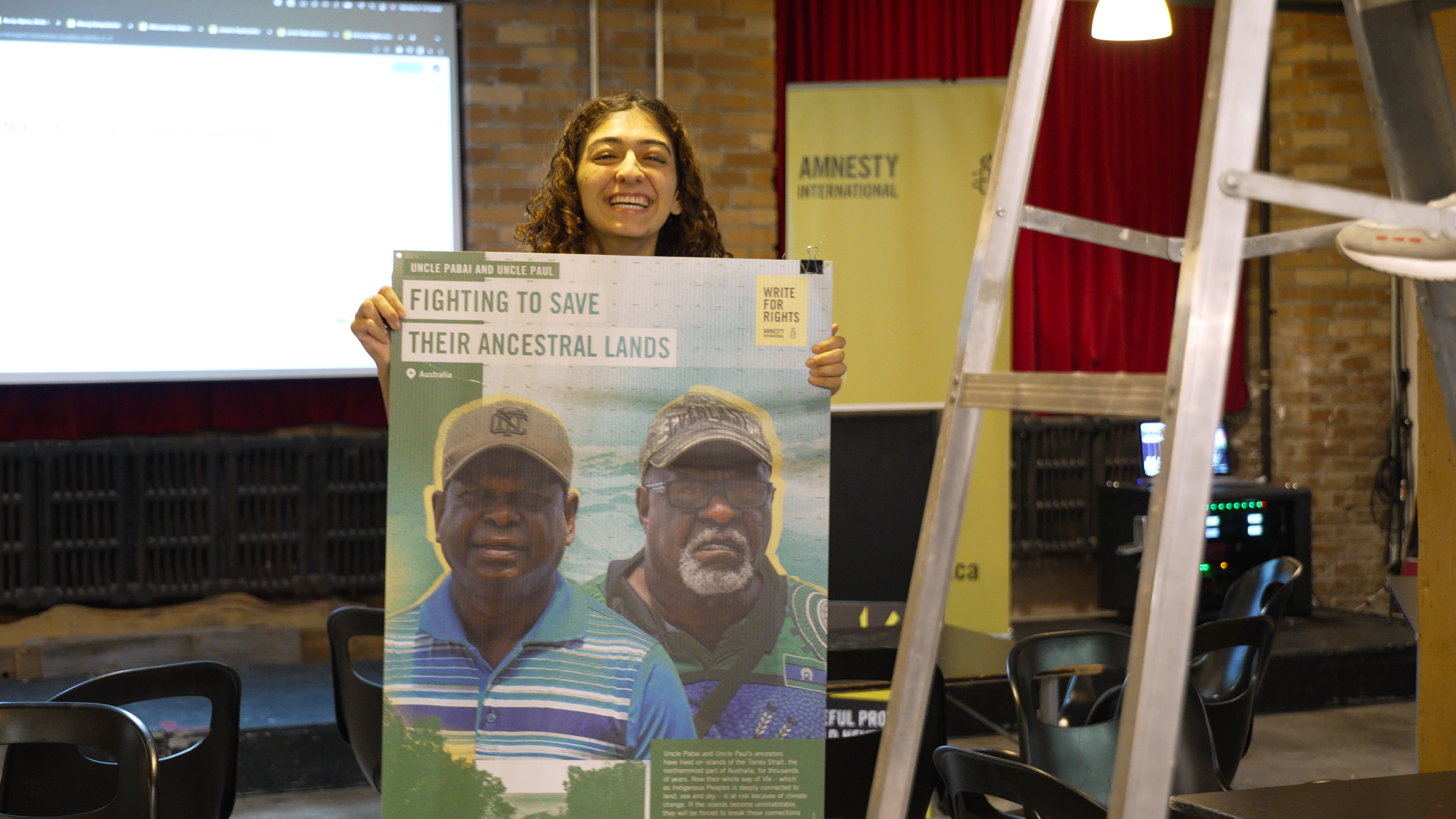 Amnesty holding up poster at Write for Rights event 2023