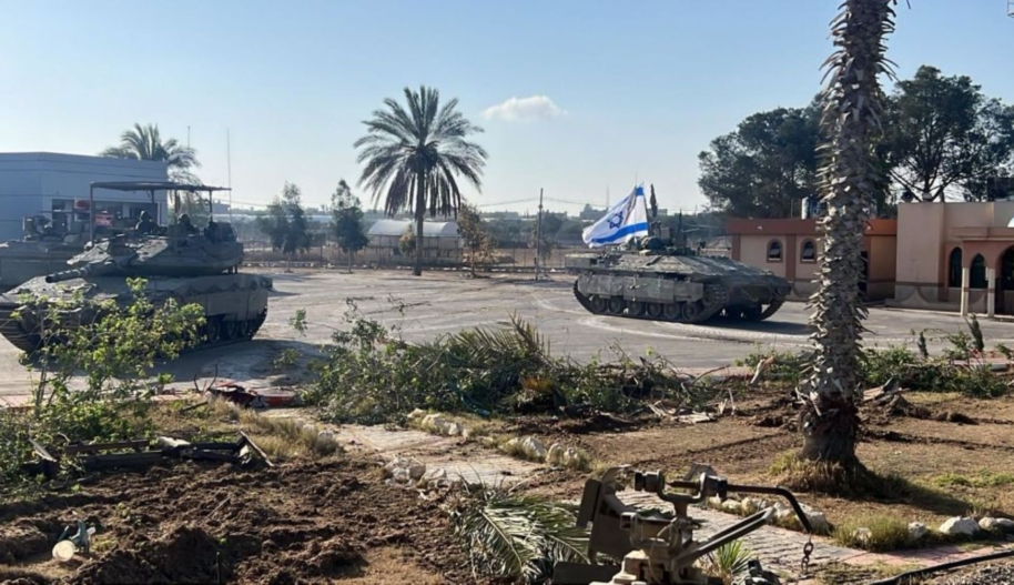 Israeli tanks are seen by the border as the Israeli army announced that it has taken control of the Palestinian side of the Rafah border crossing in Rafah, Gaza on May 06, 2024. Photo by IDF - Handout/Anadolu via Getty Images.