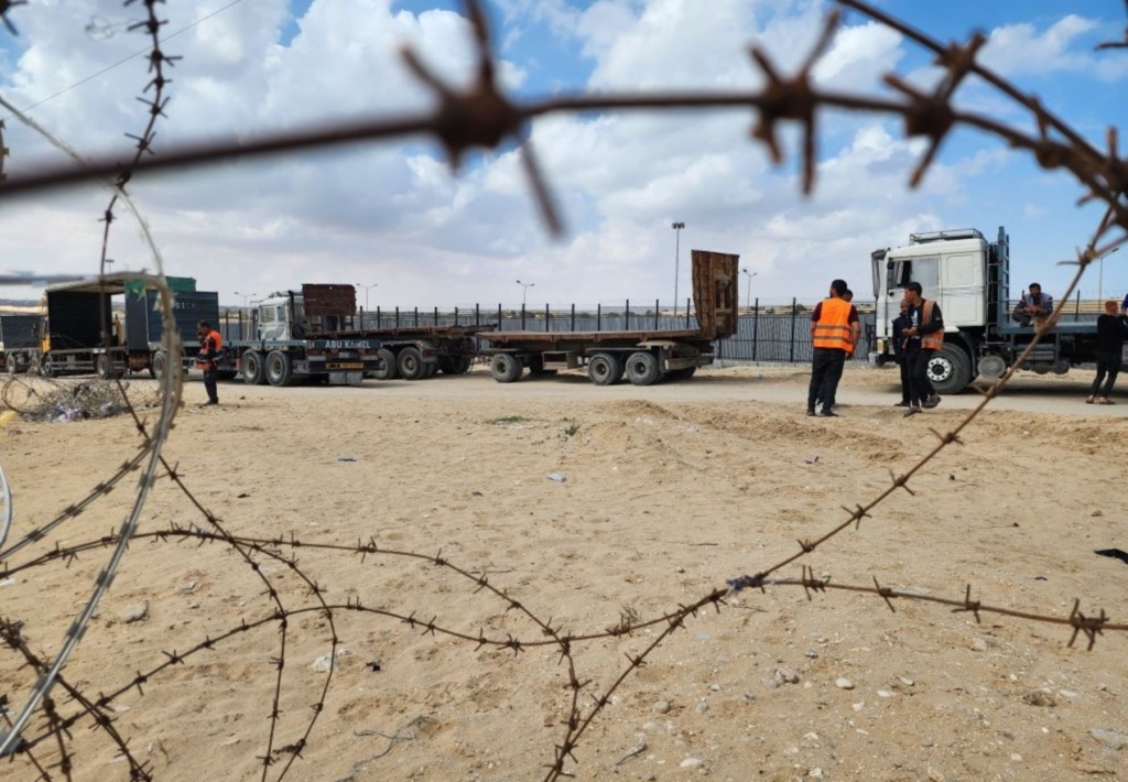 Palestinian truck drivers and United Nations vehicles wait near the Rafah border gate on the Gazan side on May 14, 2024. Photo by Hani Alshaer/Anadolu via Getty Images.