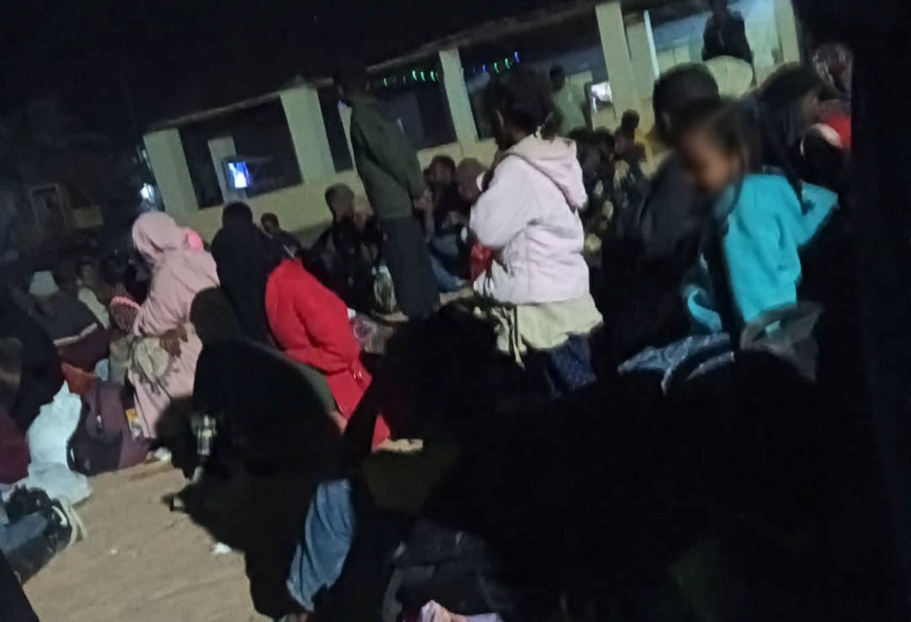 A group of Sudanese women and children detained in a makeshift detention centre inside a military site in Aswan governorate in Egypt, that borders Sudan, pending their forced return to Sudan, January 2024. (private photo)