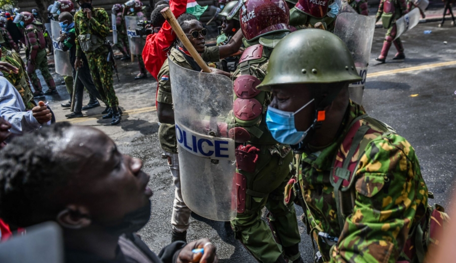 Kenyan police officers intervene in people during a protest against the tax hikes in planned 'Finance Bill 2024' as they march to the parliament building in Nairobi, Kenya on June 25, 2024. Photo by Gerald Anderson/Anadolu via Getty Images.