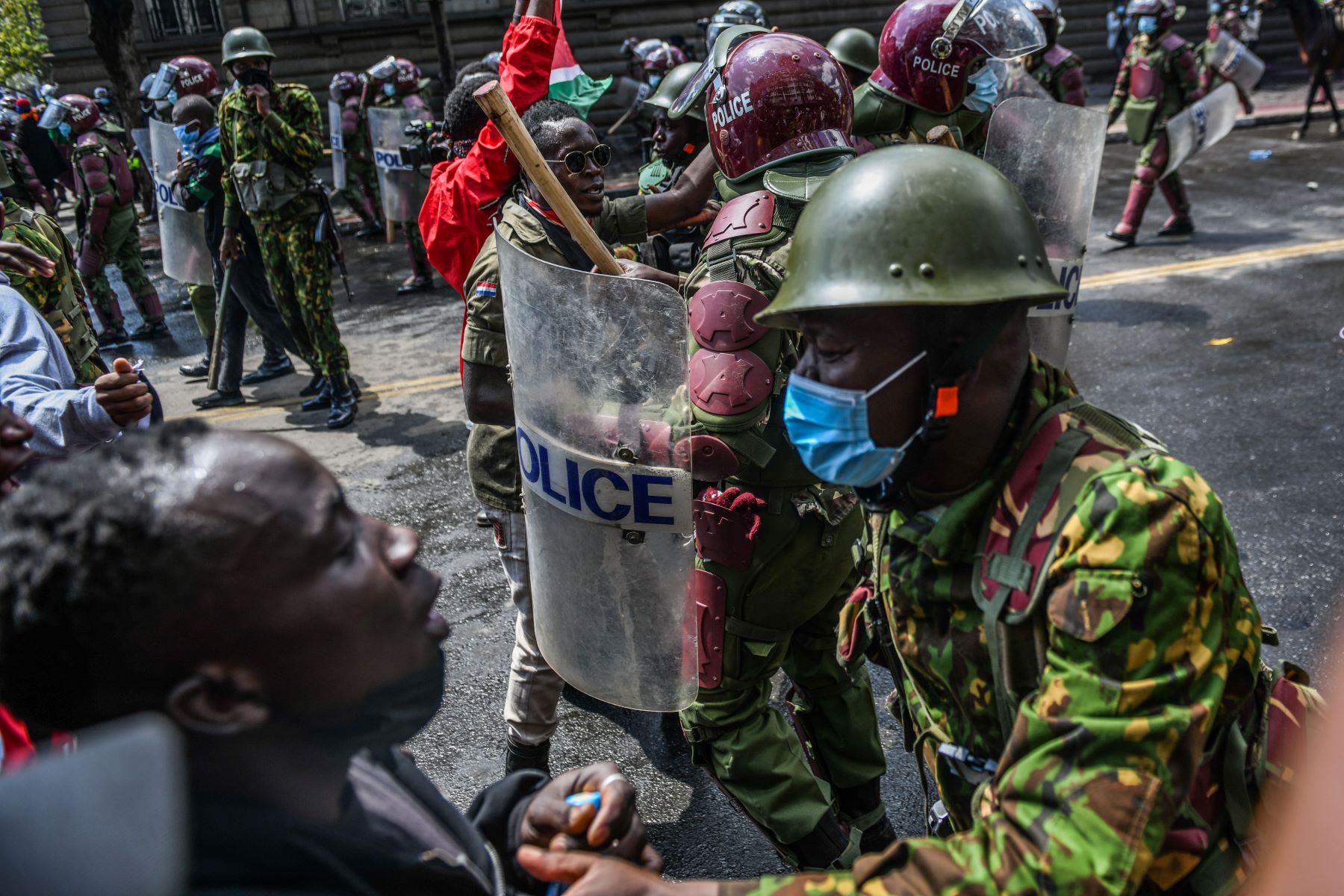 Kenyan police officers intervene in people during a protest against the tax hikes in planned 'Finance Bill 2024' as they march to the parliament building in Nairobi, Kenya on June 25, 2024. Photo by Gerald Anderson/Anadolu via Getty Images.