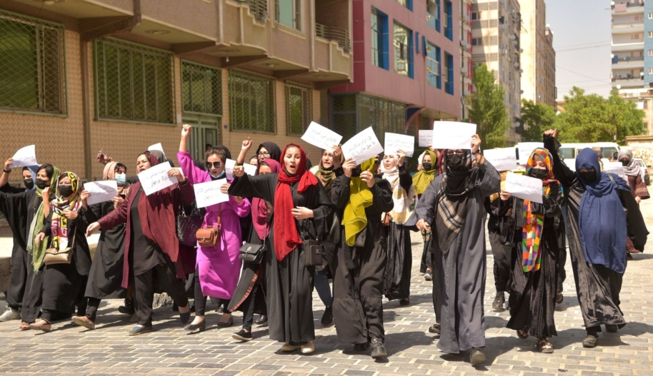 Afghan women hold placards as they march to protest for their rights, in Kabul on April 29, 2023. Photo by AFP via Getty Images.