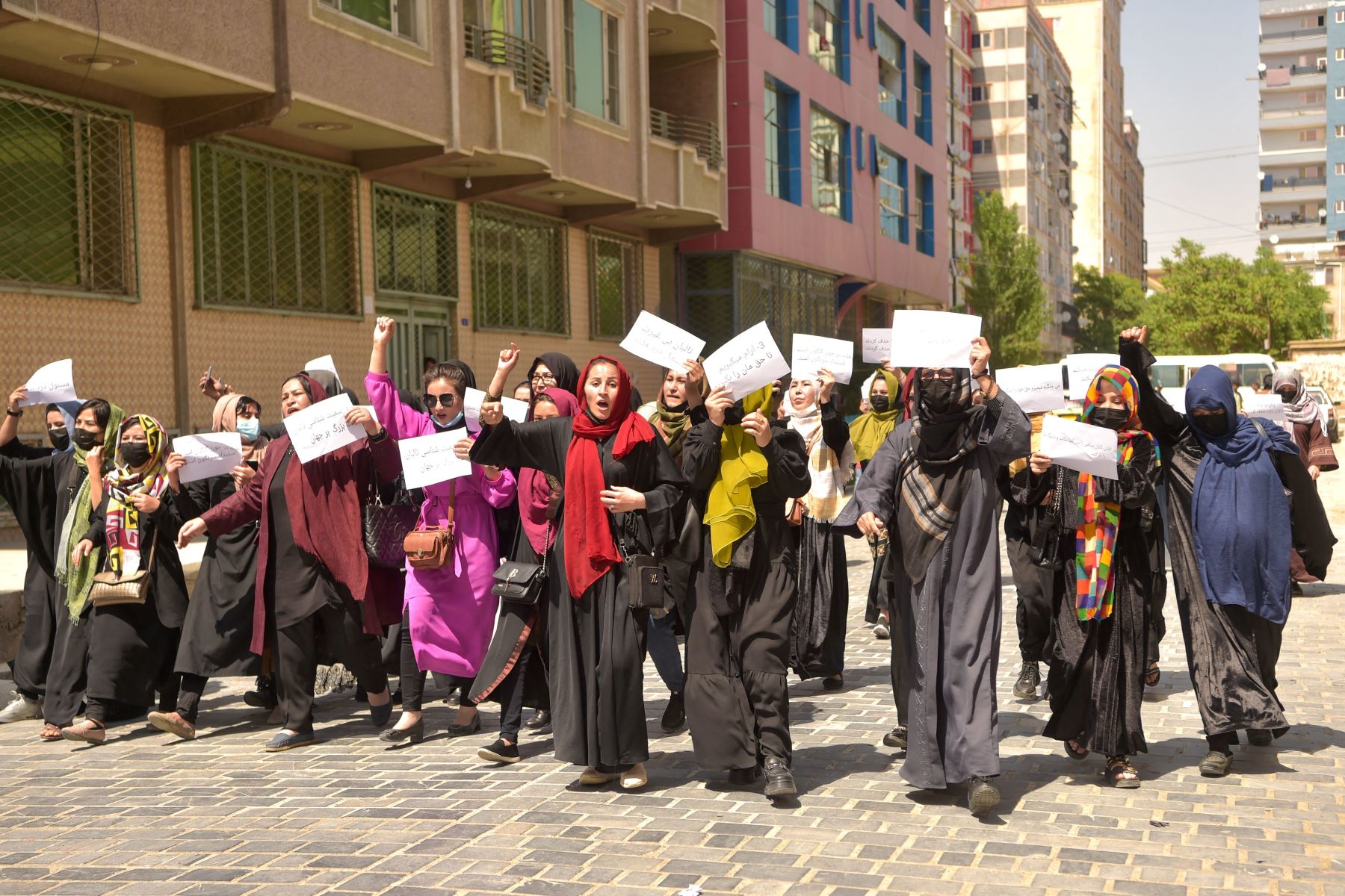 Afghan women hold placards as they march to protest for their rights, in Kabul on April 29, 2023. Photo by AFP via Getty Images.
