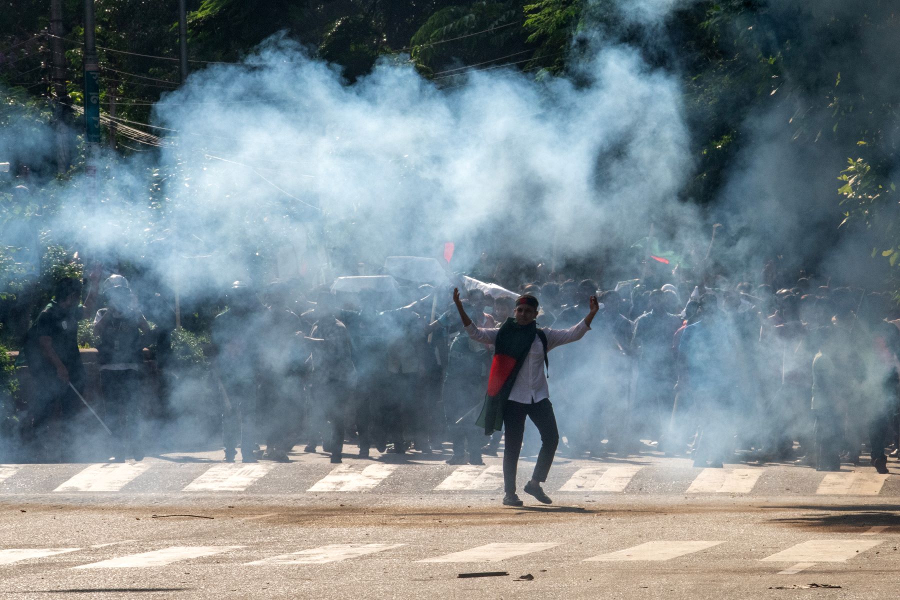 Police fire teargas during a coffin rally of anti-quota protesters at the University of Dhaka, a day after the clash with Bangladesh Chhatra League, the student wing of the ruling party Bangladesh Awami League, in Dhaka, Bangladesh. July 17, 2024. © Syed Mahamudur Rahman/NurPhoto via Getty Images