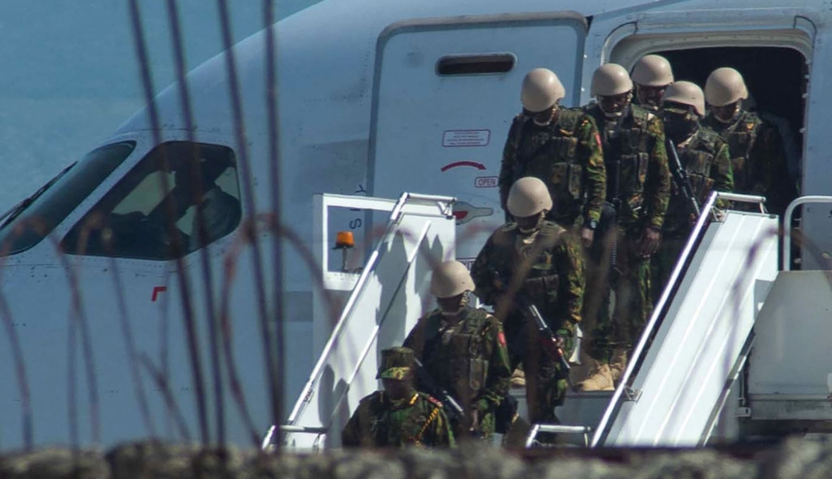 Kenyan security forces arrive at Toussaint Louverture International Airport in Port-au-Prince on June 25, 2024. The Kenyan forces begin a high-stakes mission to restore order in the Western Hemisphere's poorest nation. Photo by CLARENS SIFFROY/AFP via Getty Images.