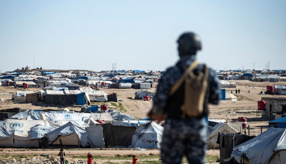 Special forces of the Syrian Democratic Forces keep watch on March 30, 2021 in the vicinity of al-Hol camp, the larger of two Kurdish-run displacement camps for relatives of Islamic State jihadists in Syria's northeast. Photo by DELIL SOULEIMAN/AFP via Getty Images.