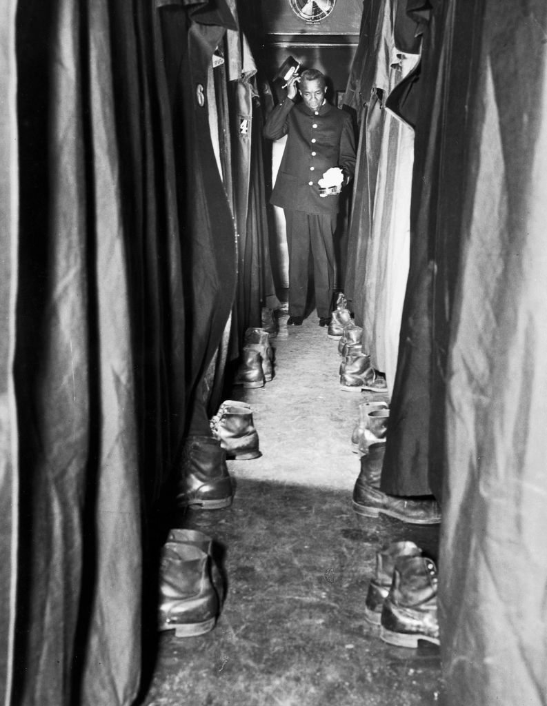 Sleeping car porter with shoe polish, 1935. Photo by Hulton Archive/Getty Images