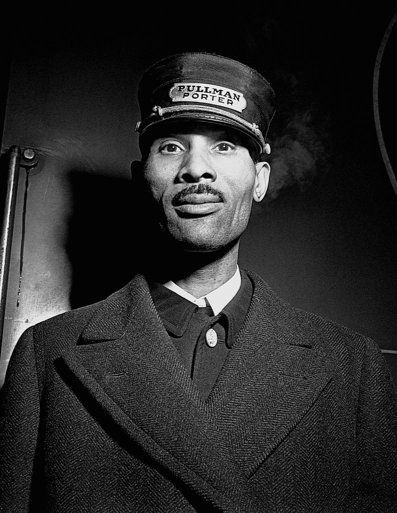 A Pullman sleeping car porter poses for the camera, 1943. Photo by Jack Delano via Corbis/Getty Images.