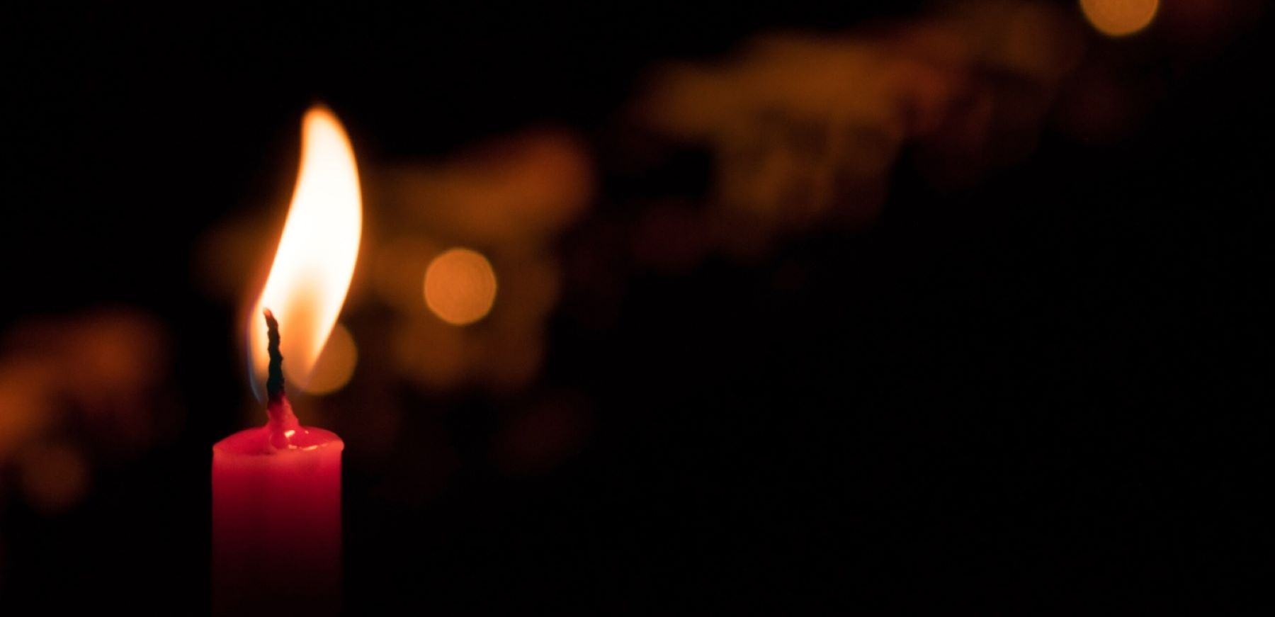 A lighted candle on October 7