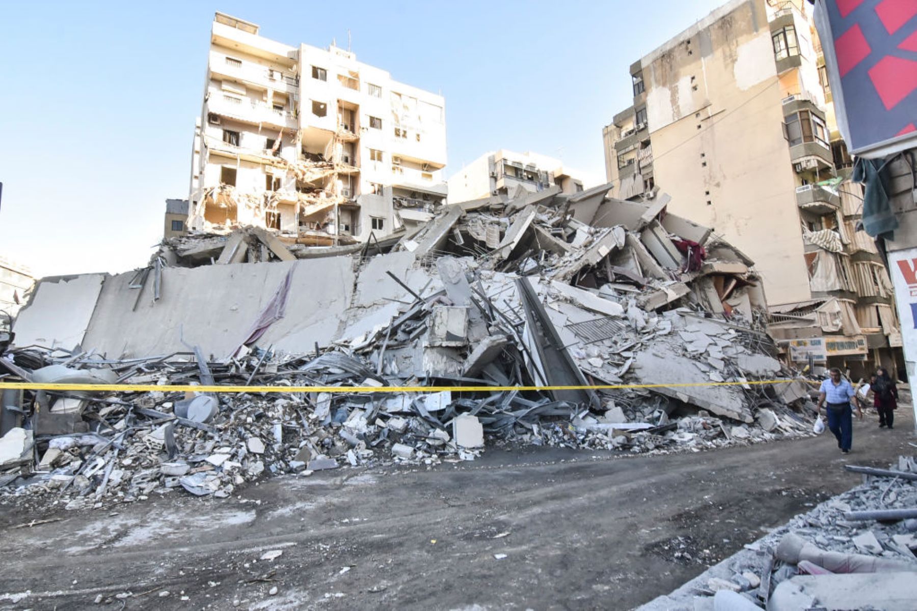 A view of the destruction after the Israeli army targets Bank Kared Al Hassan with a series of airstrikes on the suburb of Dahieh, as debris removal work continues in the area in Beirut, Lebanon, on October 21, 2024. A building targeted in the attack collapses, causing damage to surrounding buildings and vehicles. Photo by Fadel Itani/NurPhoto via Getty Images.