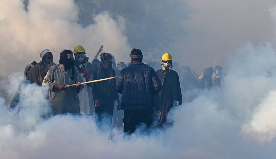 Policemen fire tear gas shells to disperse supporters of Pakistan Tehreek-e-Insaf (PTI) party during a protest to demand the release of former prime minister Imran Khan, in Islamabad on November 26, 2024. Photo by AAMIR QURESHI/AFP via Getty Images.