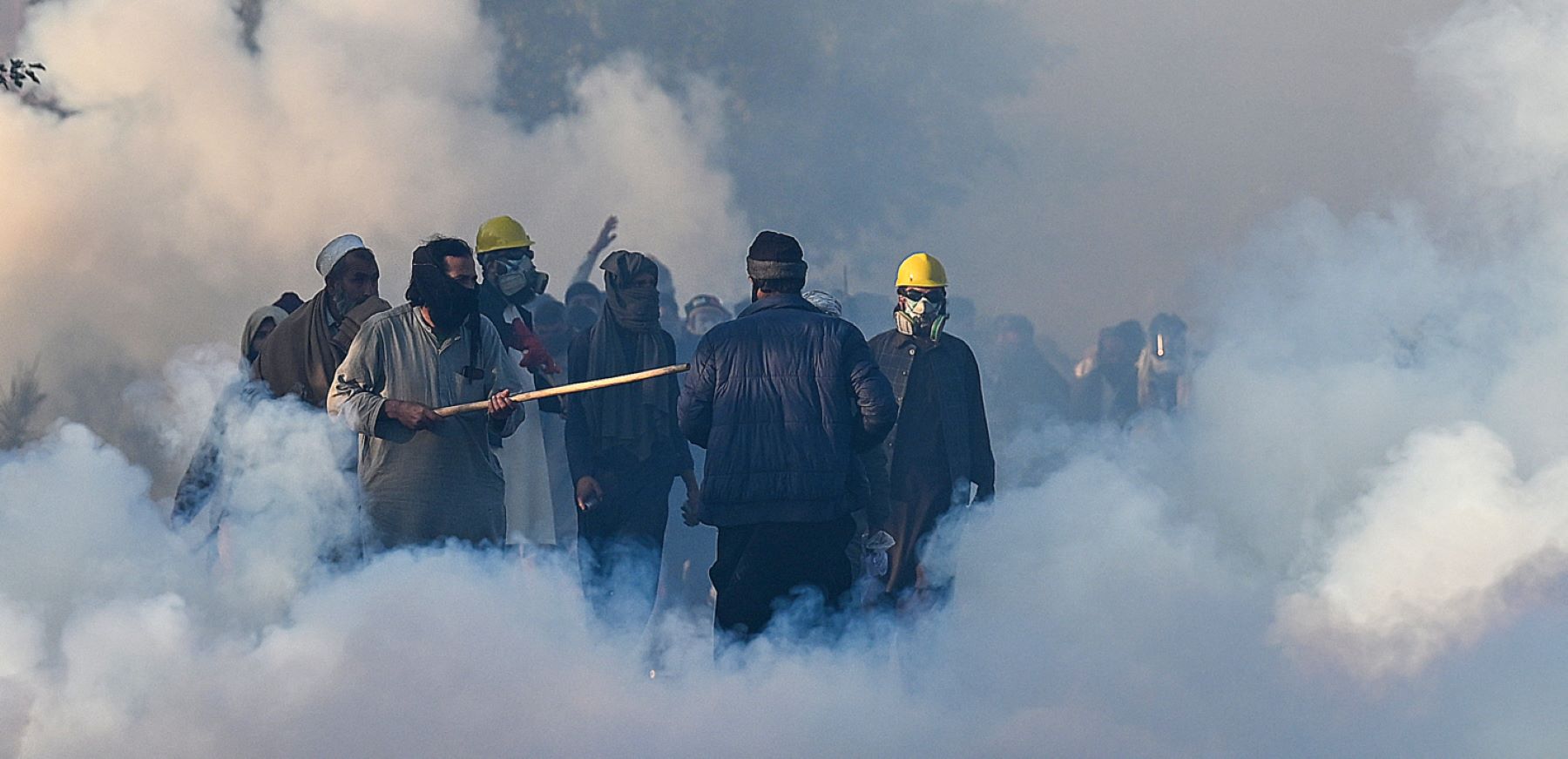 Policemen fire tear gas shells to disperse supporters of Pakistan Tehreek-e-Insaf (PTI) party during a protest to demand the release of former prime minister Imran Khan, in Islamabad on November 26, 2024. Photo by AAMIR QURESHI/AFP via Getty Images.