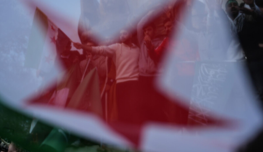 Syrian people living in Istanbul gather in Sarachane Park, Fatih district to celebrate with Syrian opposition's 'revolution flag' in their hands as sixty-one years of Baath Party rule in Syria collapses on Sunday when the capital Damascus fell out of the hands of regime control, on December 08, 2024 in Turkiye. (Photo by Hakan Akgun/Anadolu via Getty Images)