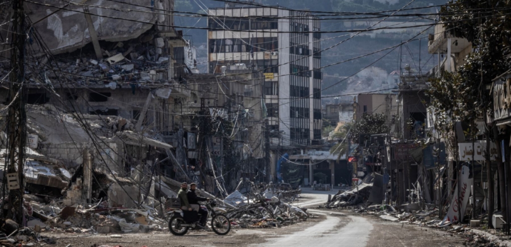 Damaged buildings stand near the rubble of Nabatiehs municipality building, which was destroyed in multiple Israeli airstrikes on 16th October 2024 on November 8, 2024 in Nabatieh, Lebanon. Photo by Ed Ram/Getty Images.