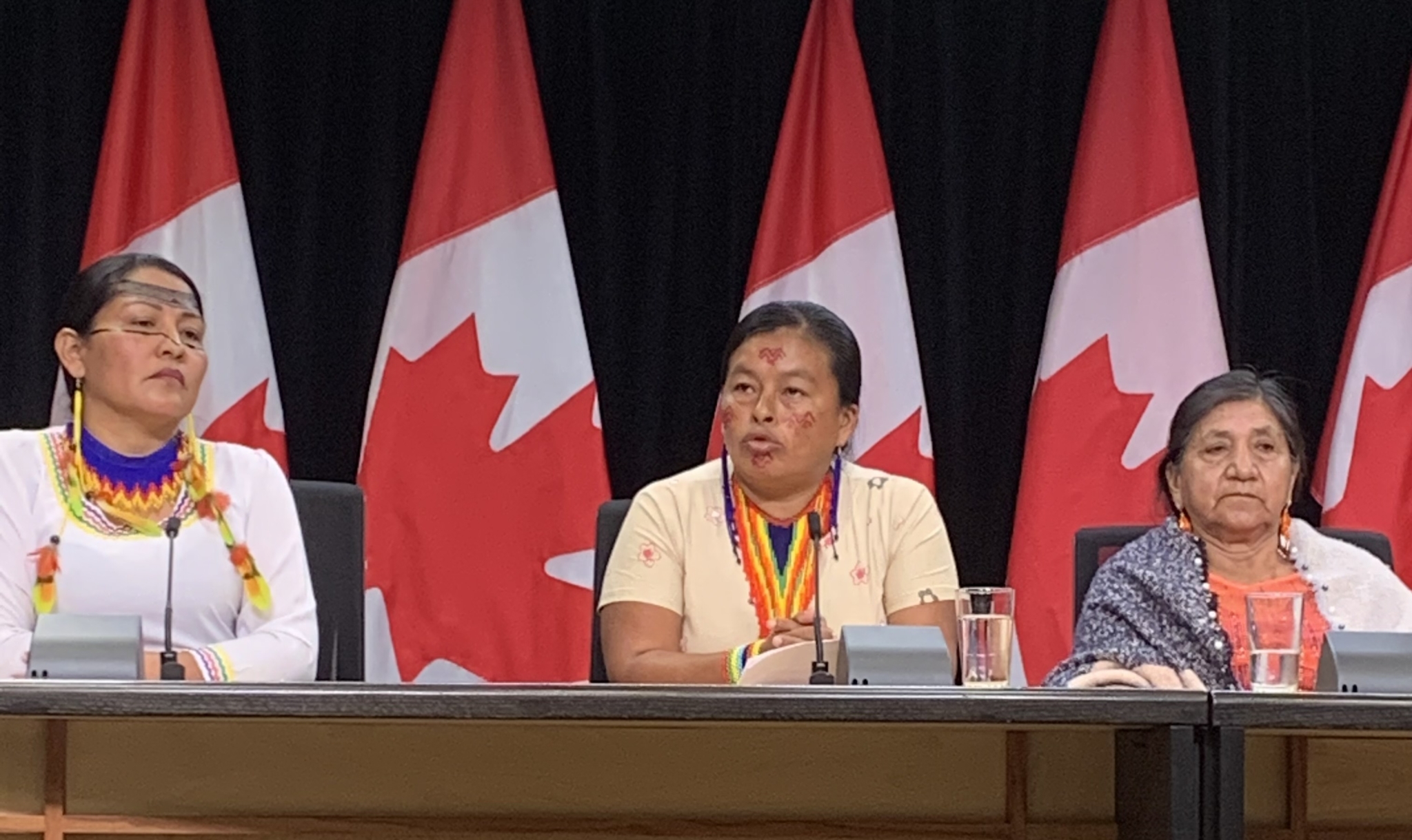 Fanny Kaekat speaks at a press conference on Parliament Hill with other Ecuadorian women rights defenders.