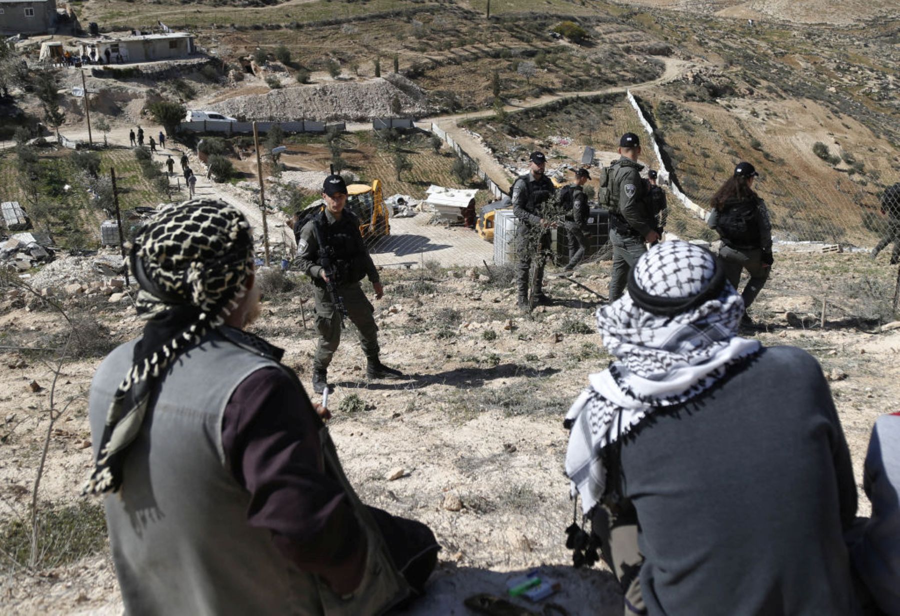 Israeli forces carrying out a demolition in Masafer Yatta . Photo by Wisam Hashlamoun/Anadolu via Getty Images.