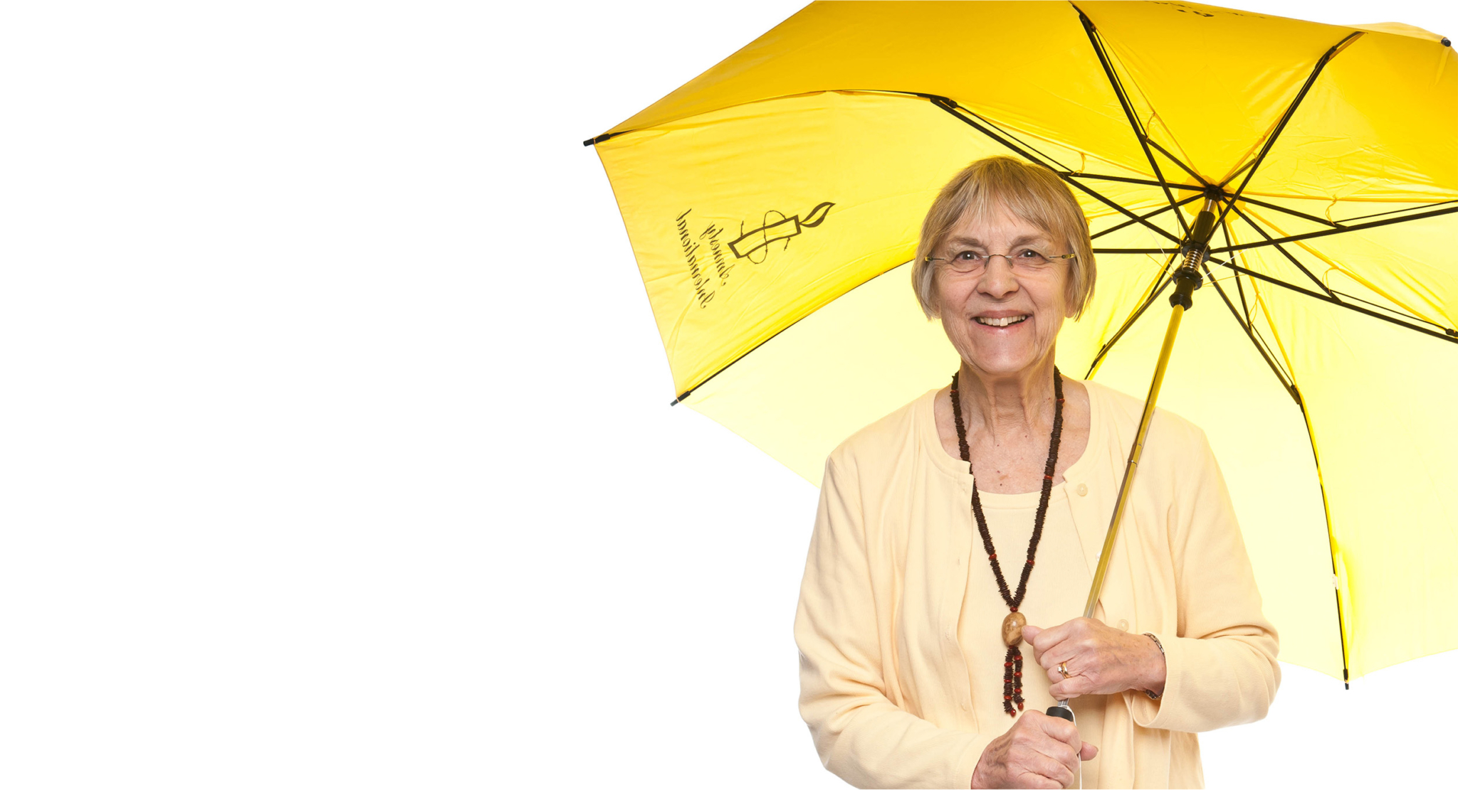 Woman smiling holding an Amnesty umbrella