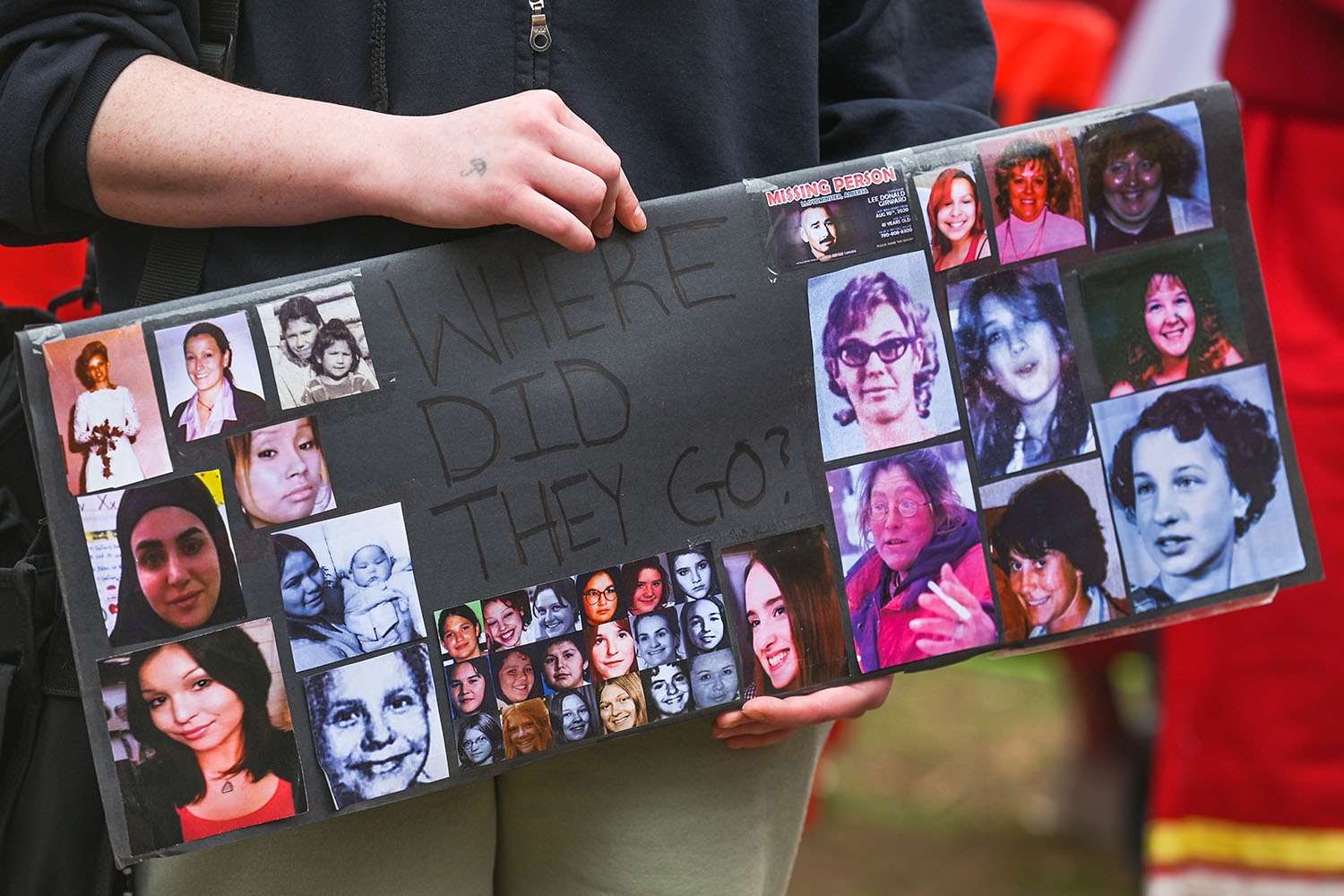 A sign with images of women that reads "Where did they go?"
