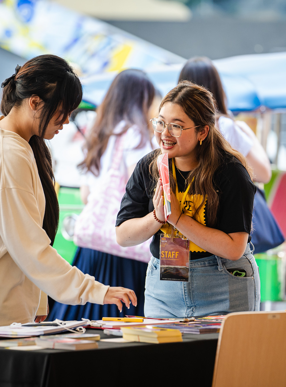Girl asking a question to a participant at an event