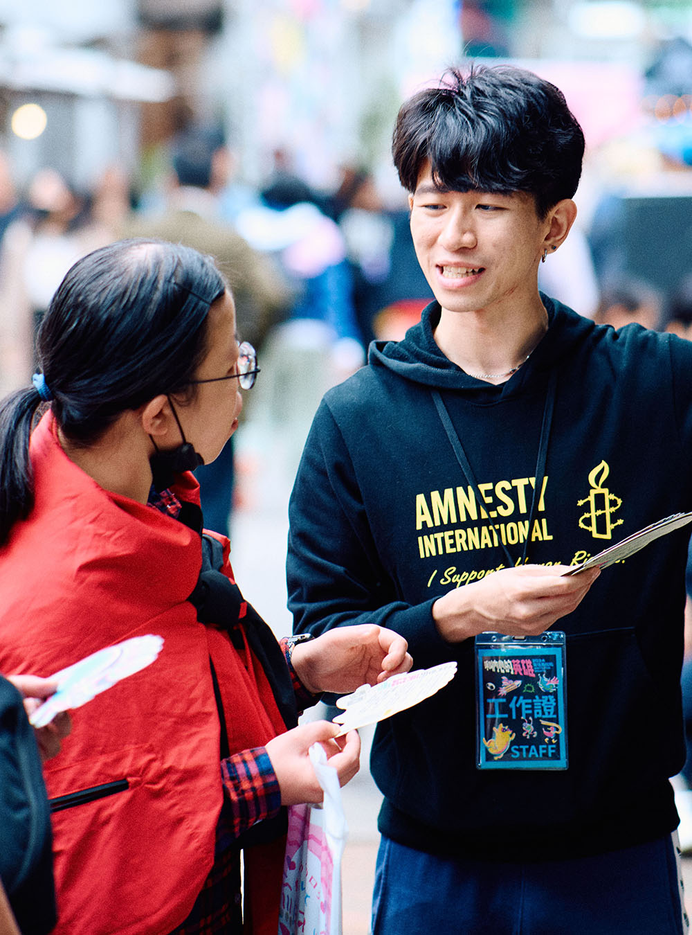 Young man guiding people to where they need to go