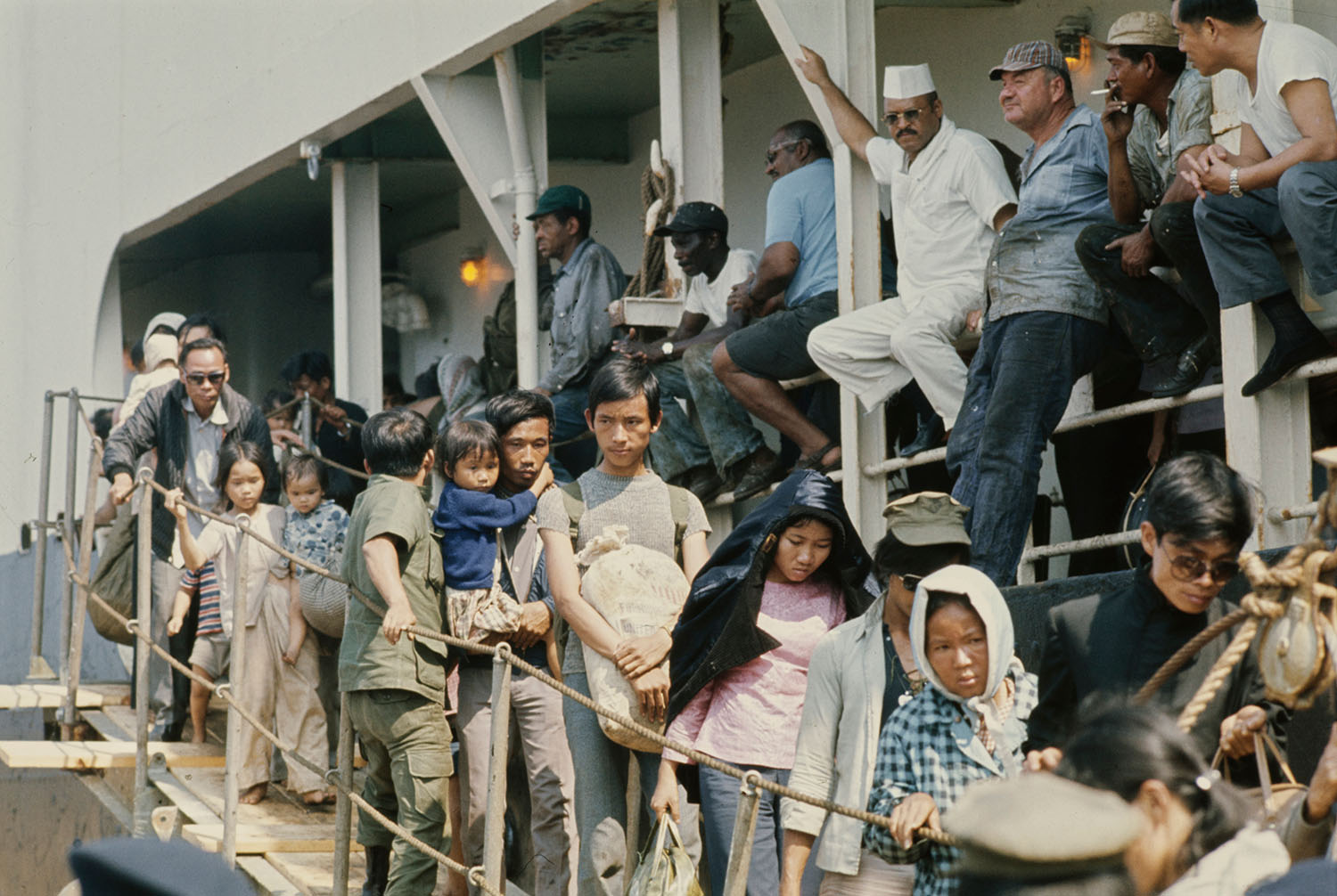 Vietnamese refugees exiting a boat