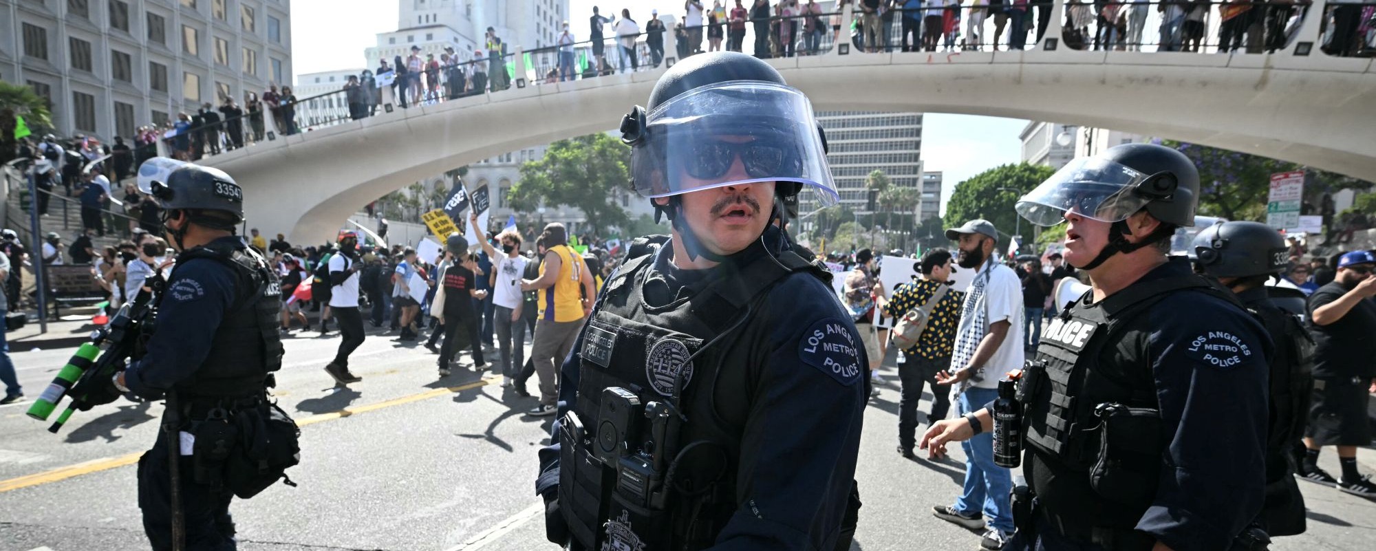 Sheriff's deputies and police clear an intersection near the Federal Building after declaring an unlawful assembly during the "No Kings" protest against the Trump administration in Los Angeles on June 14, 2025 on the day of Trump's military parade in Washington, DC. Photo by ROBYN BECK/AFP via Getty Images.