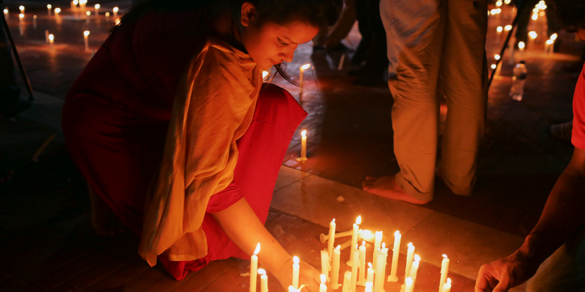 Indigenous Peoples of Bangladesh light up candles at the Jatiyo Shaheed Minar in Dhaka on August 8th, 2018, as they rehearse to celebrate International Day of the World's Indigenous Peoples on August 9, 2018. (Photo by Kazi Salahuddin Razu/NurPhoto via Getty Images)
