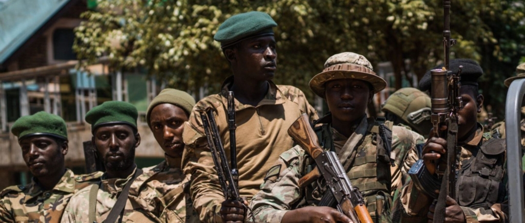 M23 rebels escort a column of surrendering Congolese police officers on February 22, 2025 in Bukavu, Democratic Republic of Congo. Photo by Hugh Kinsella Cunningham/Getty Images.