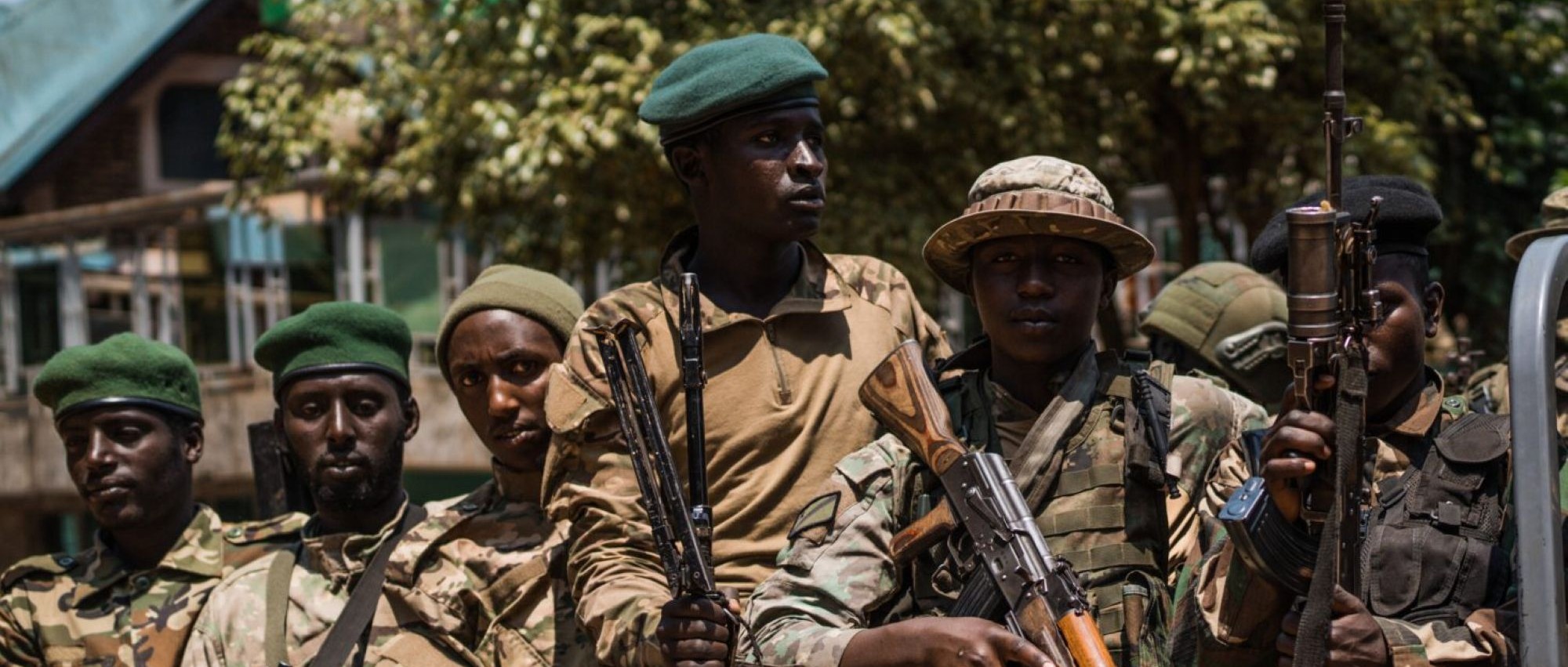 M23 rebels escort a column of surrendering Congolese police officers on February 22, 2025 in Bukavu, Democratic Republic of Congo. Photo by Hugh Kinsella Cunningham/Getty Images.