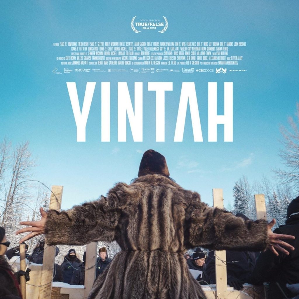 YINTAH documentary film poster image with woman with her back to the camera wearing a fur coat and standing with her arms out