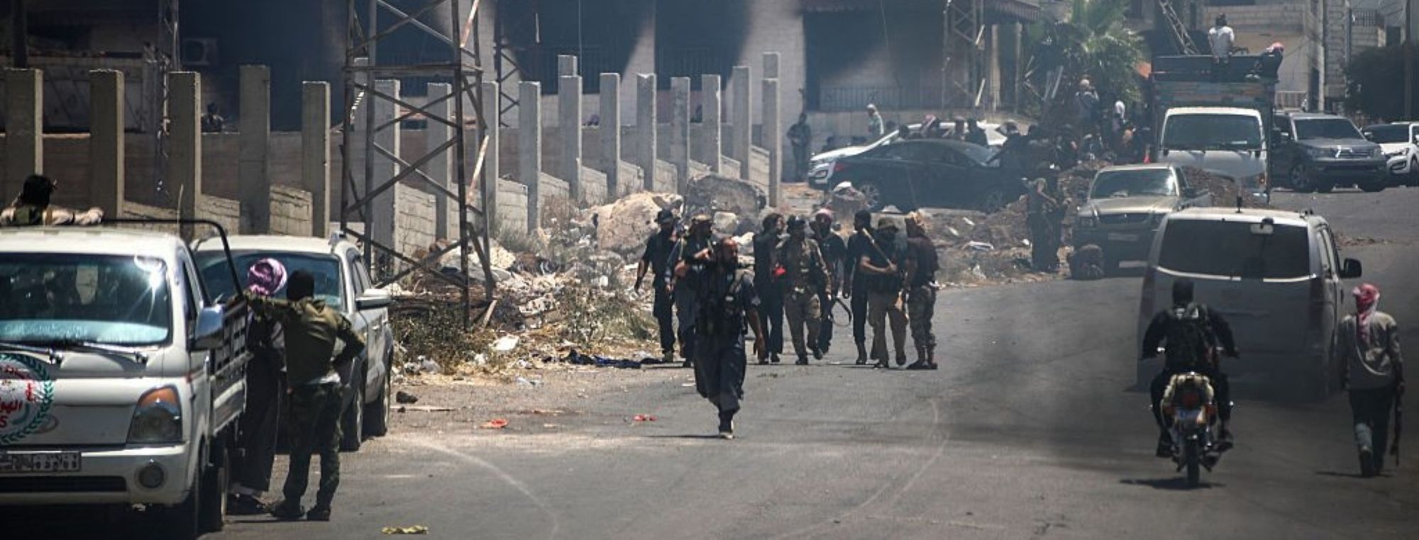 Fighters gather in the western neighbourhood of southern Syria's predominantly Druze city of Sweida, amid clashes with Druze gunmen on July 19, 2025. Photo by ABDULAZIZ KETAZ/AFP via Getty Images.