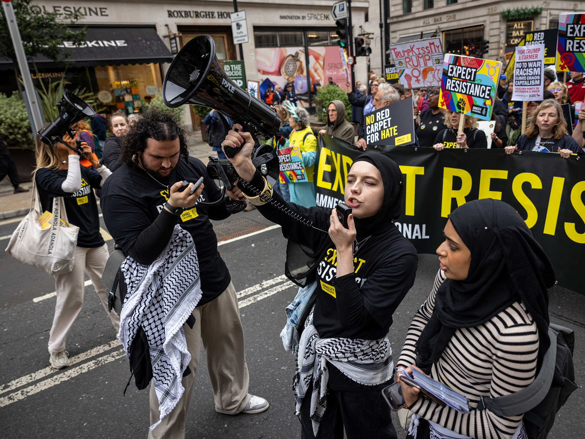 A group of Amnesty supporters rally in a Resistance protest