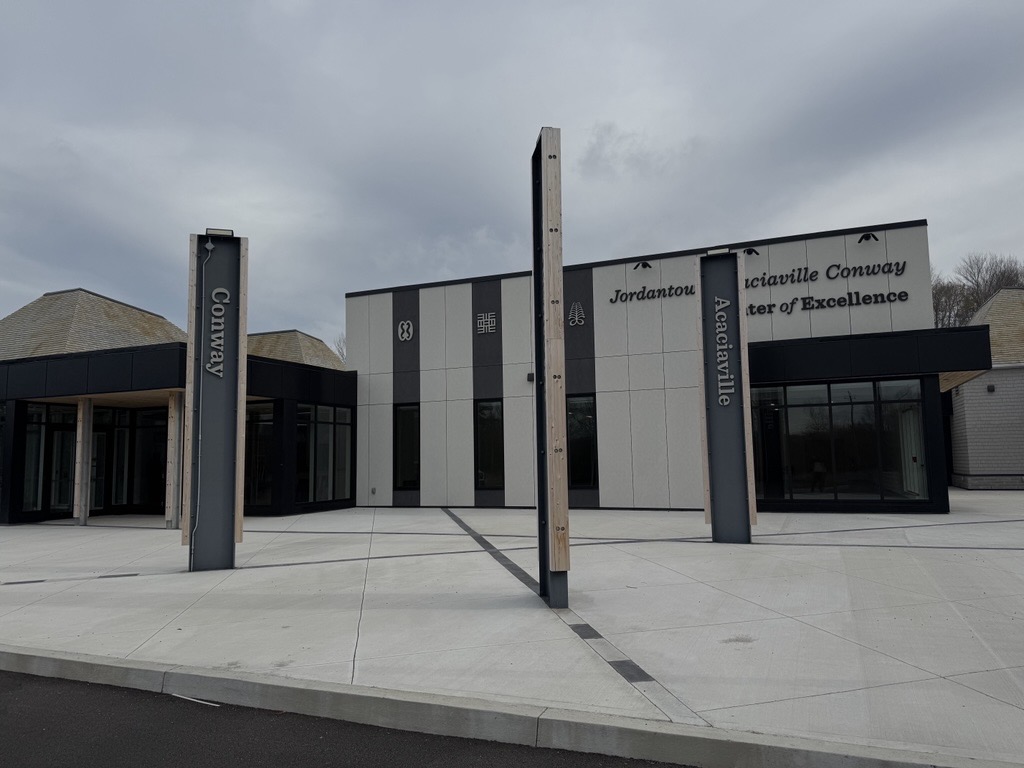 Photo: the three pillars of the JACBA centre representing the three black communities of the area: Jordantown, Acaciaville, and Conway 