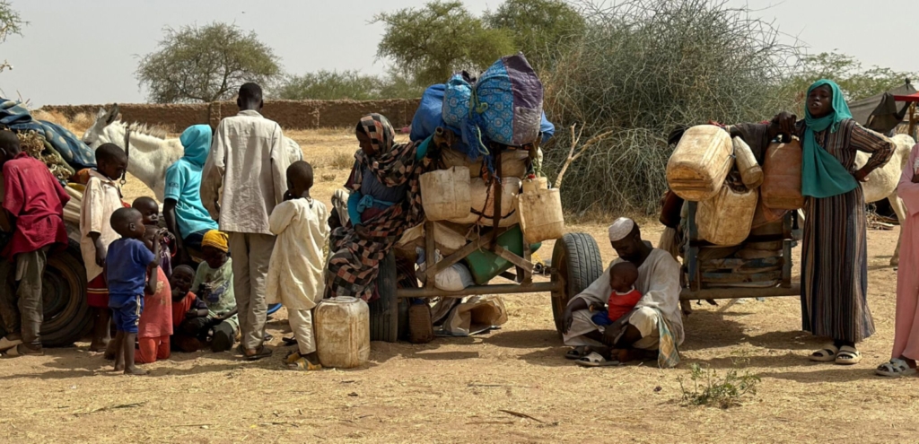 People who fled the Zamzam camp for the internally displaced after it fell under RSF control, rest in a makeshift encampment in an open field near the town of Tawila in war-torn Sudan's western Darfur region on April 13, 2025. Photo by AFP via Getty Images.