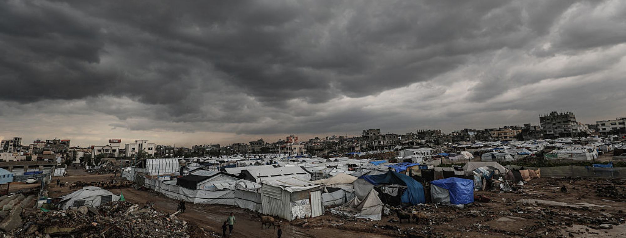 Palestinians struggle with flooding after heavy rain hits the Bureij Refugee Camp in Gaza City, Gaza on December 16, 2025. Photo by Moiz Salhi/Anadolu via Getty Images.
