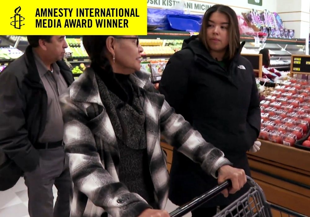 3 people shopping in a grocery store