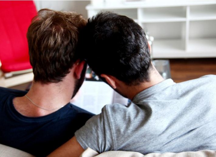 Jamal and Said relax in their new home in Berlin, Germany, September 2015. © Amnesty International
